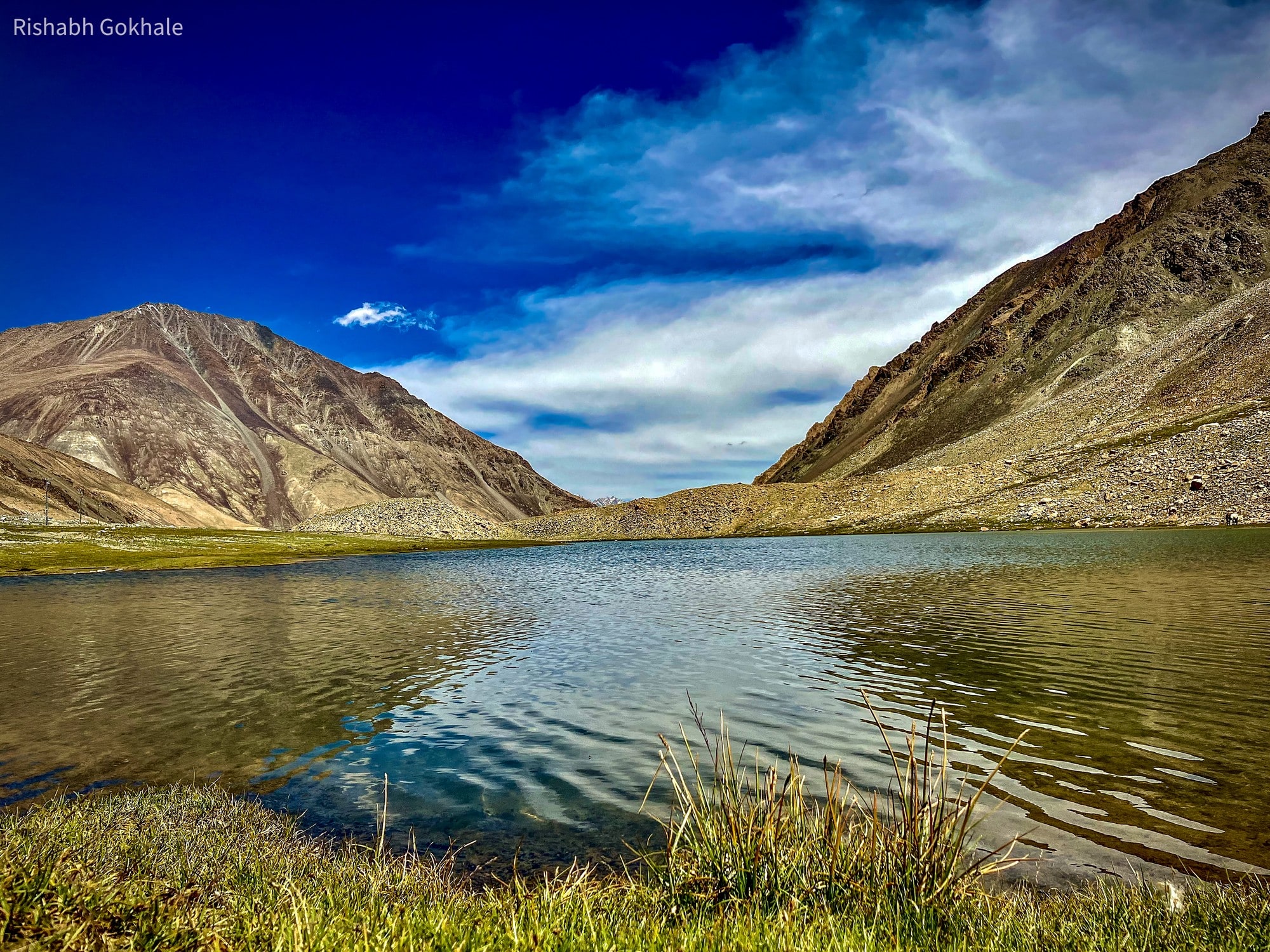 A mountain lake in Ladakh under a blue sky
