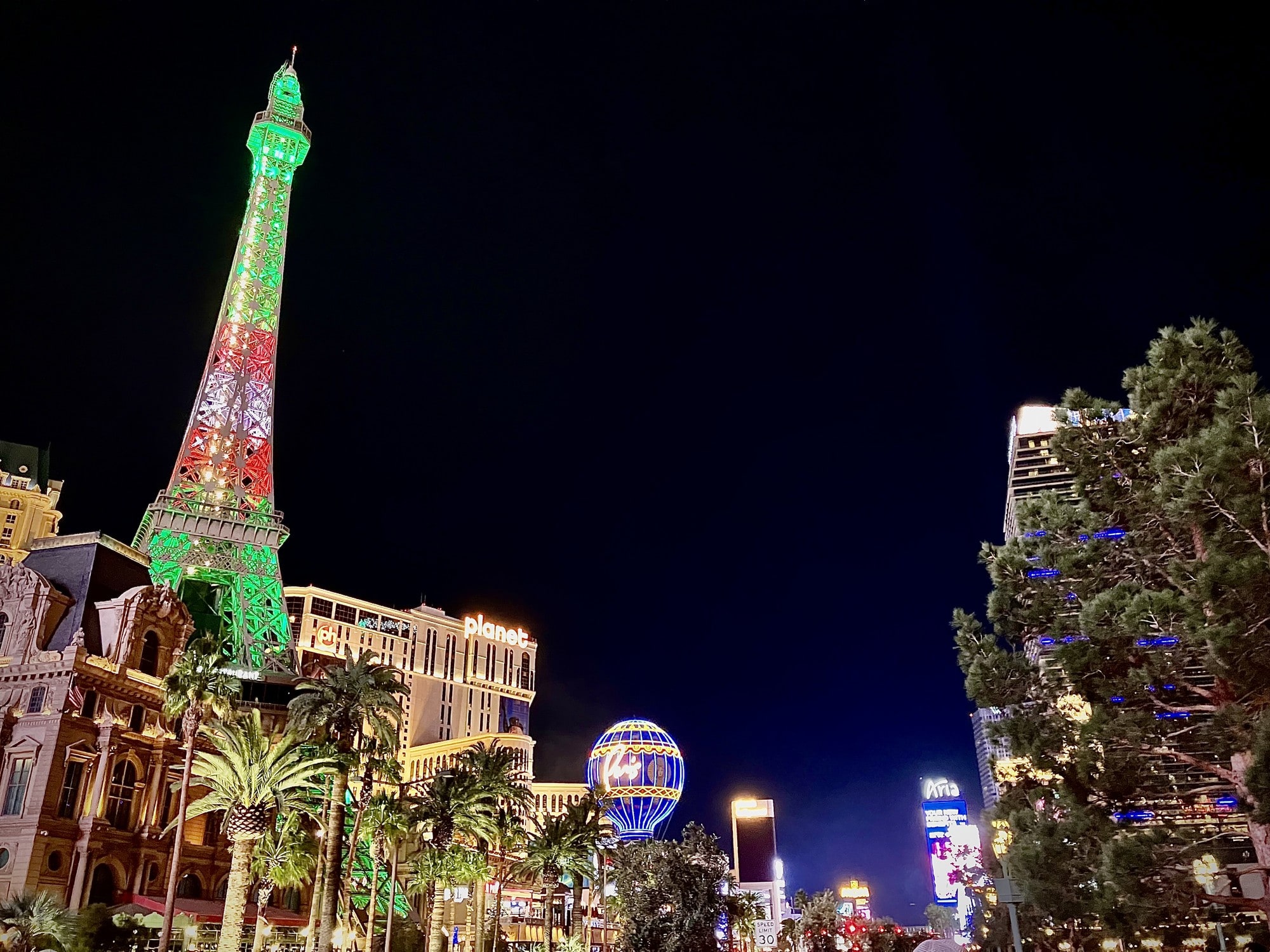 The Las Vegas Strip at night, with a replica Eiffel Tower